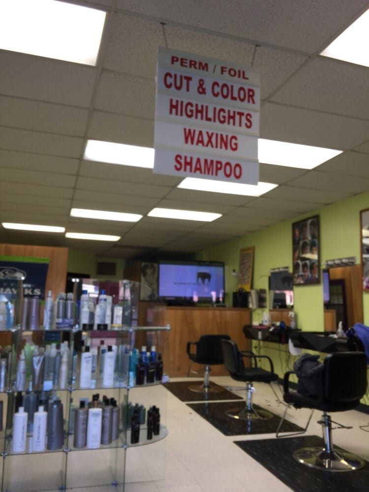 Styling chairs and service menu sign at Cherry Hair Design