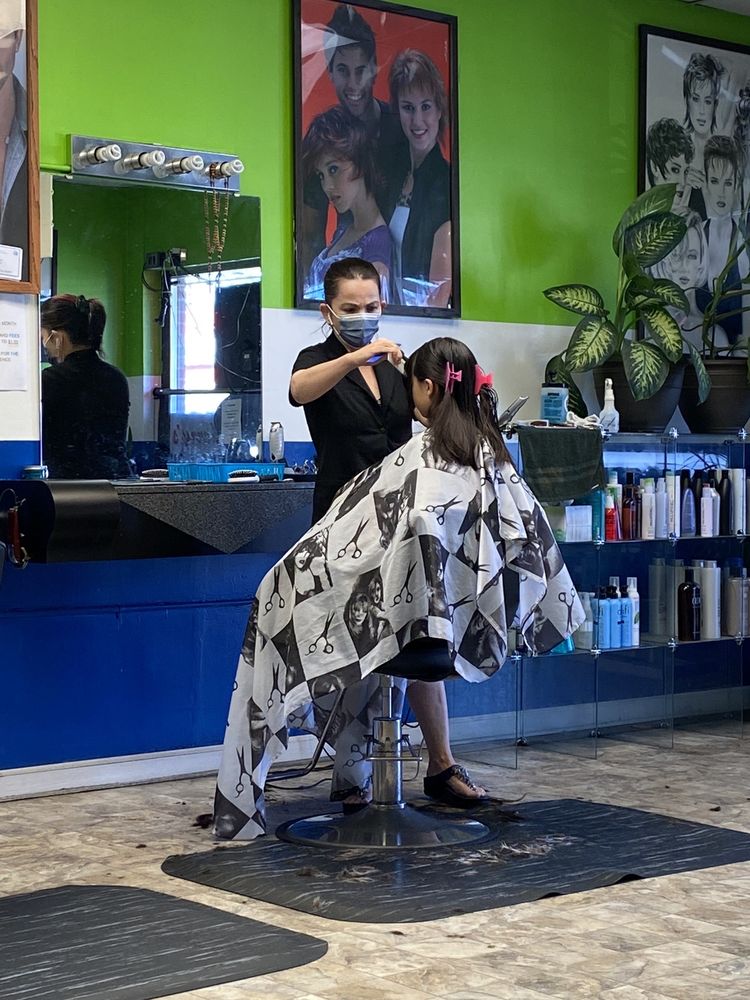 Stylist giving a haircut at Cherry Hair Design, Seattle