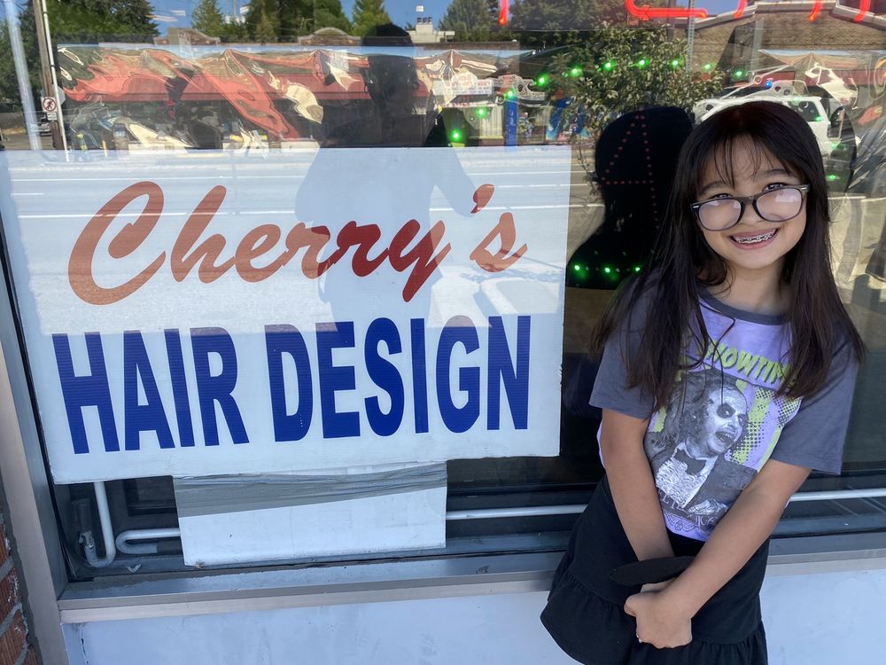 Close-up of the hand-painted Cherry's Hair Design sign, Seattle