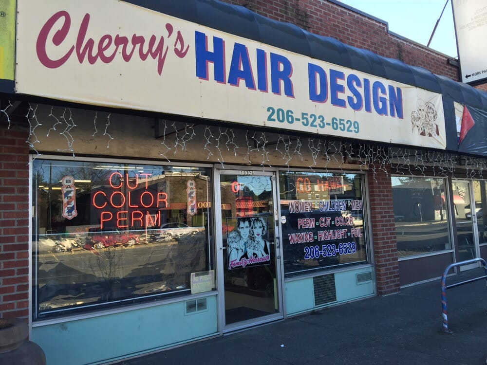 Cherry Hair Design storefront on Aurora Ave N, Seattle, with a neon Cut Color Perm sign in the window